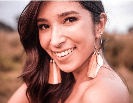 woman smiling in field 